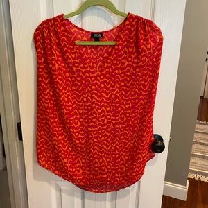 ANA tank top with ties at the end of the sleeves.